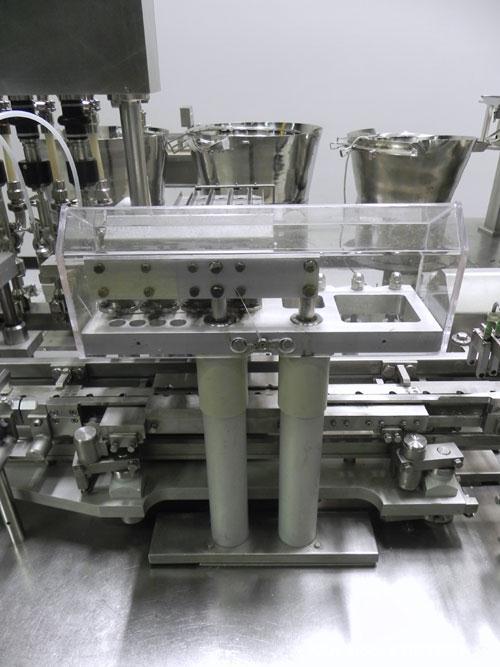 Used Groninger Syringe Filling Line, stainless steel on product contact parts. Line consists of model DFVK4000S inline (4) head filler, RTA3005 filler and HEA100 labeler.