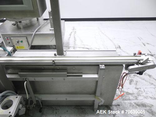 Used Groninger Syringe Filling Line, stainless steel on product contact parts. Line consists of model DFVK4000S inline (4) head filler, RTA3005 filler and HEA100 labeler.