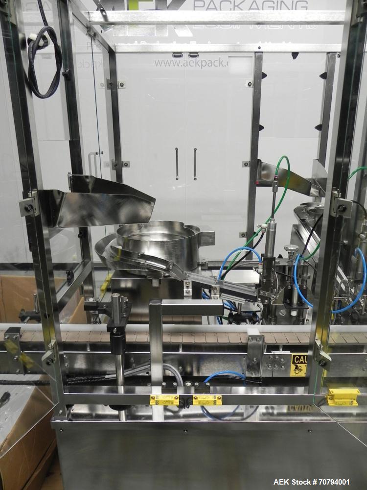 Used Intellitech IntelliFiller Model AFS I-3500C Liquid Filler Stopper and Screw / Crimp Capper. Monoblock Machine is capable of speeds up to 45 (1-up) and 90 (2-up) containers per minute. Machine ac...