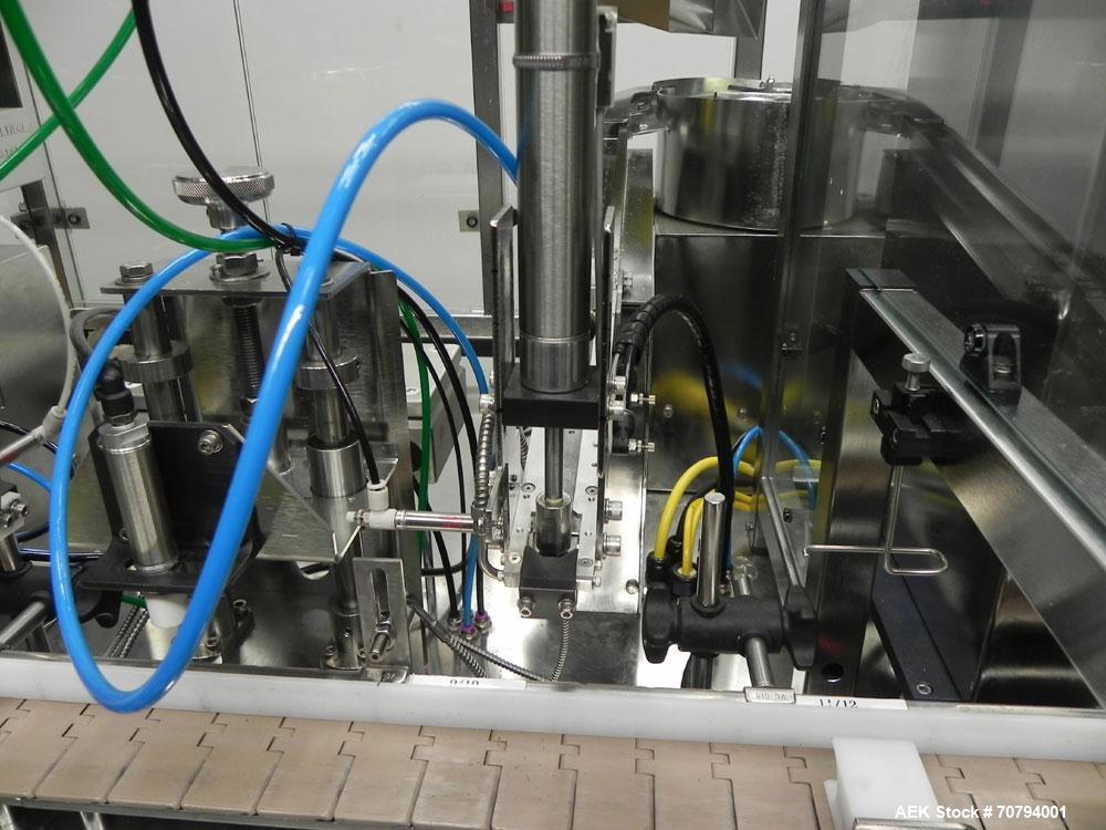 Used Intellitech IntelliFiller Model AFS I-3500C Liquid Filler Stopper and Screw / Crimp Capper. Monoblock Machine is capable of speeds up to 45 (1-up) and 90 (2-up) containers per minute. Machine ac...