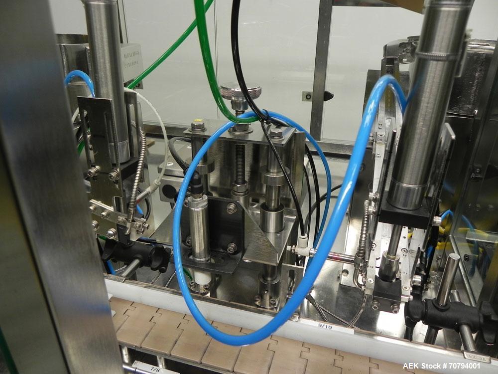 Used Intellitech IntelliFiller Model AFS I-3500C Liquid Filler Stopper and Screw / Crimp Capper. Monoblock Machine is capable of speeds up to 45 (1-up) and 90 (2-up) containers per minute. Machine ac...