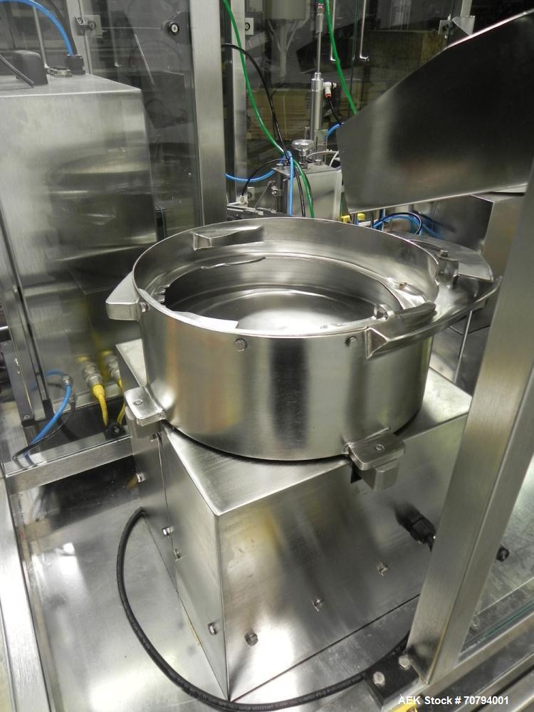Used Intellitech IntelliFiller Model AFS I-3500C Liquid Filler Stopper and Screw / Crimp Capper. Monoblock Machine is capable of speeds up to 45 (1-up) and 90 (2-up) containers per minute. Machine ac...