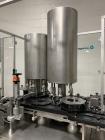 Used Used Groninger inserter capper, Model KVK 206, speeds up to 10000 BPH(166 BPM), with (2) 6 head stations, currently set up with (6) head dropper inserter, and (6) head capper stations, 30 - 230 ...