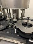 Used Used Groninger inserter capper, Model KVK 206, speeds up to 10000 BPH(166 BPM), with (2) 6 head stations, currently set up with (6) head dropper inserter, and (6) head capper stations, 30 - 230 ...