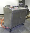 Used Bosch TL Systems Monoblock Vial Filler & Stoppering Machine. Consists of an 8 head rolling diaphram type filler, vial indexing system and stopper inserter. Has 8 filling heads with a filling rat...