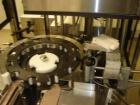 Used Chase Logeman Monoblock Filling Line, Model FPCCL4-12H.  Designed to fill, plug, cap and label at speeds up to 60 containers/minute; fill range from 1 - 125 mL; cap size range from 8 - 32 mm; IM...
