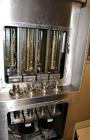 Used Cozzoli VR2S Monoblock Filler and Stoppering Machine. Capable of speeds up to 120 vials per minute. Has four head filler and single bowl stoppering systems (requires changeparts, bowl not includ...