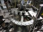 Used Comas Plastic Dispensing Syringe Monoblock Filling System, Model FD120, speeds up to 60 syringes/minute. Dual station index with 2 Ivek Peristaltic product fill pumps, Vibratory Bowl feeders for...