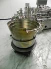 Used Groninger Syringe Filling Line, stainless steel on product contact parts. Line consists of model DFVK4000S inline (4) head filler, RTA3005 filler and HEA100 labeler.