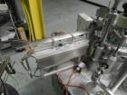 Used Groninger Syringe Filling Line, stainless steel on product contact parts. Line consists of model DFVK4000S inline (4) head filler, RTA3005 filler and HEA100 labeler.