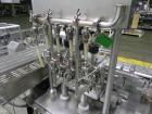 Used Groninger Syringe Filling Line, stainless steel on product contact parts. Line consists of model DFVK4000S inline (4) head filler, RTA3005 filler and HEA100 labeler.