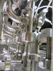 Used Groninger Syringe Filling Line, stainless steel on product contact parts. Line consists of model DFVK4000S inline (4) head filler, RTA3005 filler and HEA100 labeler.