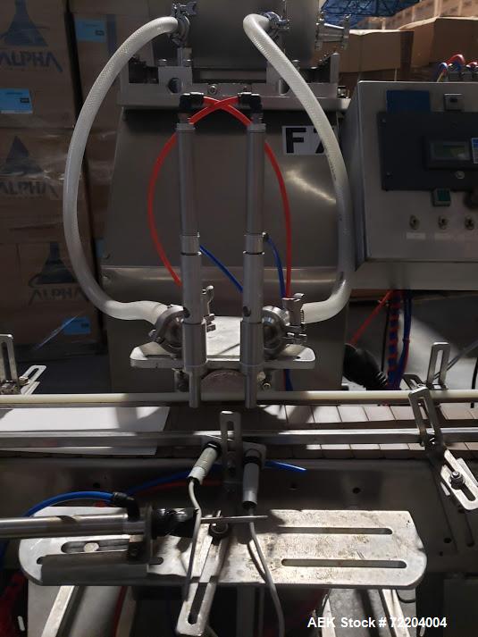 Used Keith Machinery Co Inline Piston Filler, Model RJM. Filler has 2-up positive shut-off design with pneumatic indexing. Front-mounted operator control panel.  Approx. 6 table top chain conveyor. S...