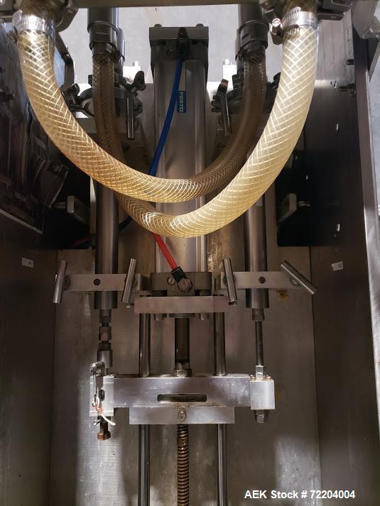 Used- Keith Machinery Co Inline Piston Filler, Model RJM. Filler has 2-up positive shut-off design with pneumatic indexing. ...