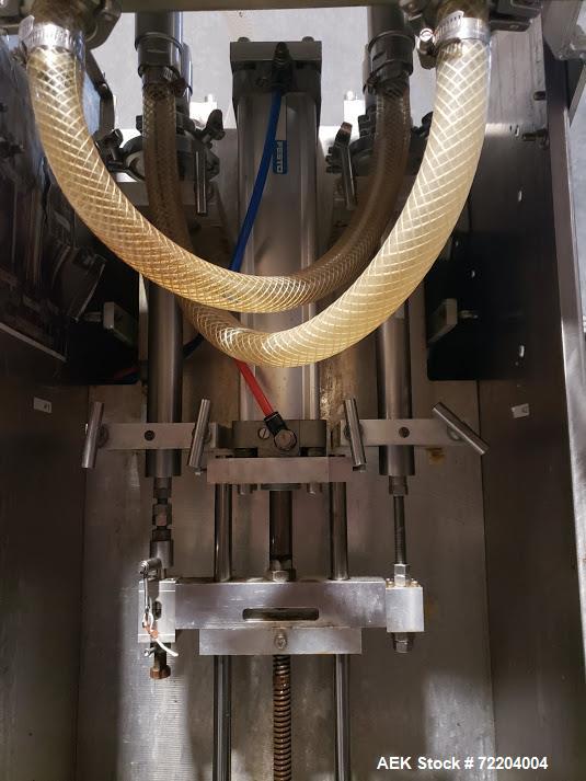 Used Keith Machinery Co Inline Piston Filler, Model RJM. Filler has 2-up positive shut-off design with pneumatic indexing. Front-mounted operator control panel.  Approx. 6 table top chain conveyor. S...