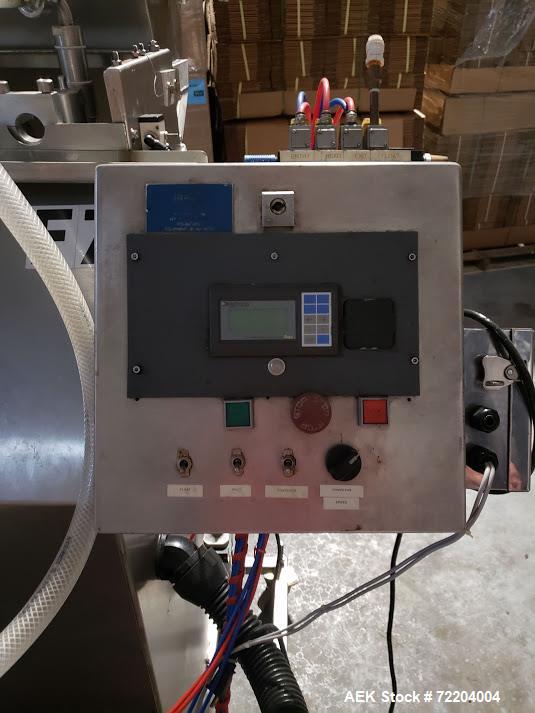 Used Keith Machinery Co Inline Piston Filler, Model RJM. Filler has 2-up positive shut-off design with pneumatic indexing. Front-mounted operator control panel.  Approx. 6 table top chain conveyor. S...