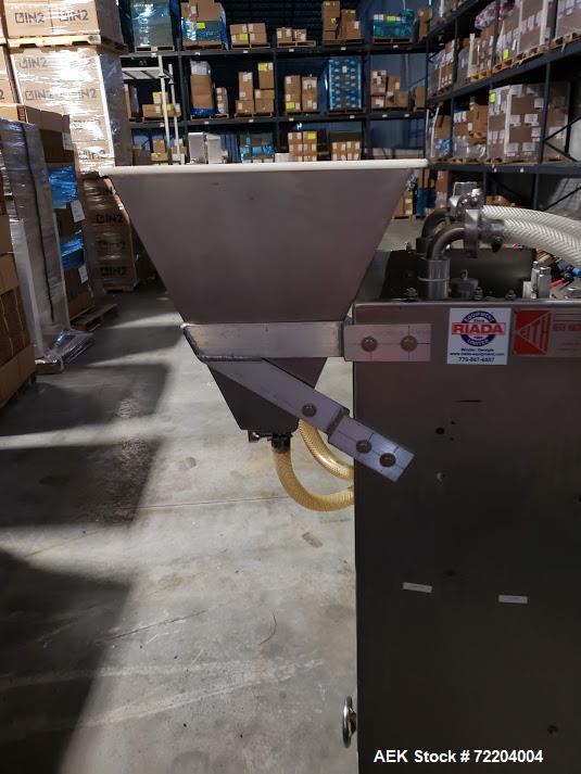 Used Keith Machinery Co Inline Piston Filler, Model RJM. Filler has 2-up positive shut-off design with pneumatic indexing. Front-mounted operator control panel.  Approx. 6 table top chain conveyor. S...
