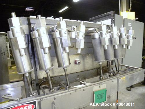 Used Filamatic (National Instruments) 8 Head In-Line Piston Filler, Model CVK-120. (8) 3/8’’ diameter nozzles with centering bells, mounted on a 31" wide adjustable slotted filling bar. Has bottom up...