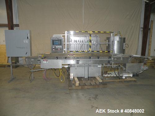 Used Filamatic (National Instruments) 12 Head In-Line Piston Filler. (12) 3/8’’ diameter nozzles with (9) centering bells, bottom up fill. (12) approximate 520cc pistons. Star wheel container indexin...