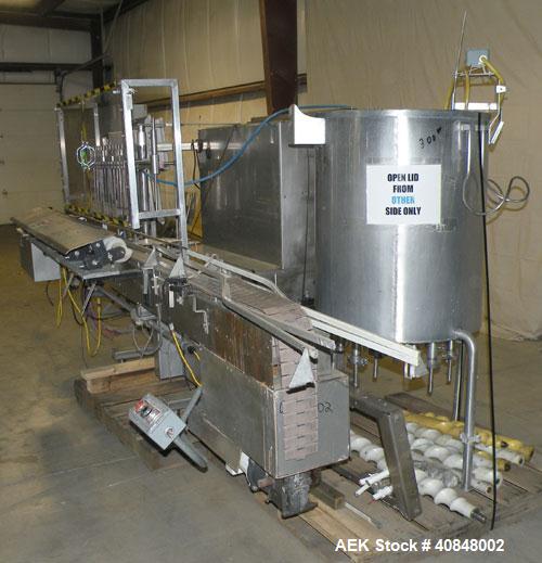 Used Filamatic (National Instruments) 12 Head In-Line Piston Filler. (12) 3/8’’ diameter nozzles with (9) centering bells, bottom up fill. (12) approximate 520cc pistons. Star wheel container indexin...
