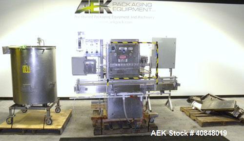 Used Filamatic (National Instruments) 10 Head In-Line Piston Filler, Model AL-800HS. No nozzles or centering bells, bottom up fill. (10) approximate 260cc pistons. Conveyor infeed and discharge. Incl...