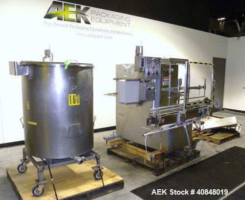Used Filamatic (National Instruments) 10 Head In-Line Piston Filler, Model AL-800HS. No nozzles or centering bells, bottom up fill. (10) approximate 260cc pistons. Conveyor infeed and discharge. Incl...