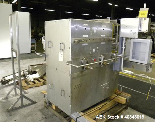 Used Filamatic (National Instruments) 10 Head In-Line Piston Filler, Model AL-800HS. No nozzles or centering bells, bottom up fill. (10) approximate 260cc pistons. Conveyor infeed and discharge. Incl...