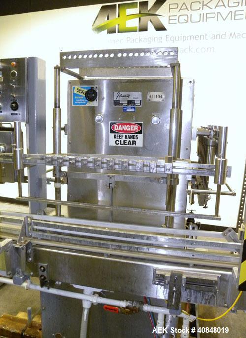 Used Filamatic (National Instruments) 10 Head In-Line Piston Filler, Model AL-800HS. No nozzles or centering bells, bottom up fill. (10) approximate 260cc pistons. Conveyor infeed and discharge. Incl...