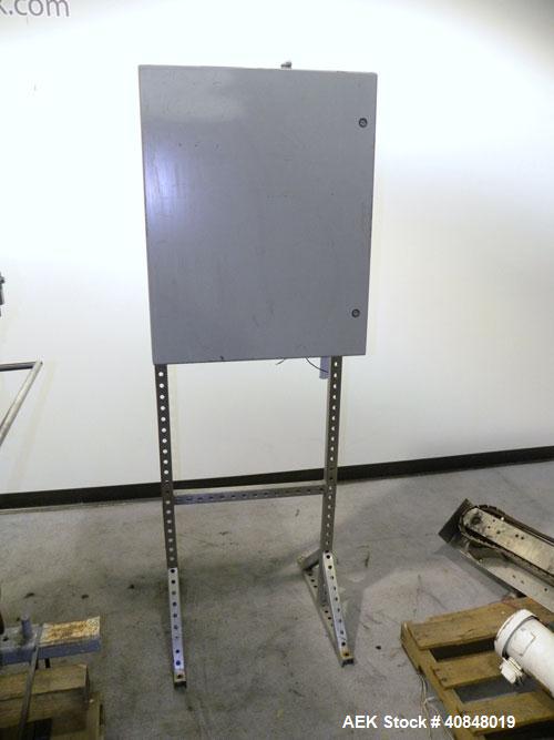 Used Filamatic (National Instruments) 10 Head In-Line Piston Filler, Model AL-800HS. No nozzles or centering bells, bottom up fill. (10) approximate 260cc pistons. Conveyor infeed and discharge. Incl...