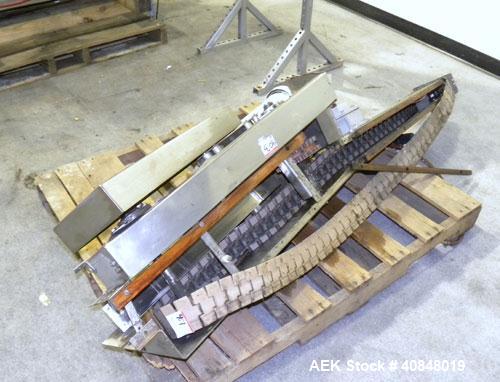 Used Filamatic (National Instruments) 10 Head In-Line Piston Filler, Model AL-800HS. No nozzles or centering bells, bottom up fill. (10) approximate 260cc pistons. Conveyor infeed and discharge. Incl...
