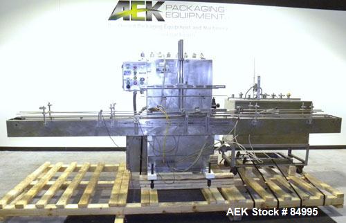 Used Filamatic Inline Piston Filler, Model CVK-300-1. Equipped with (8) 1000 cc pistons, all stainless steel. Automatic diving nozzle style, missing nozzles. Pneumatic container indexing. Self-contai...