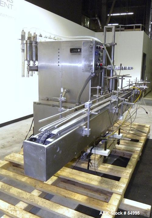 Used Filamatic Inline Piston Filler, Model CVK-300-1. Equipped with (8) 1000 cc pistons, all stainless steel. Automatic diving nozzle style, missing nozzles. Pneumatic container indexing. Self-contai...