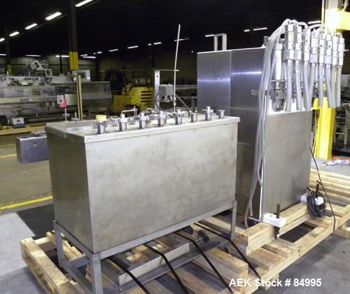 Used Filamatic Inline Piston Filler, Model CVK-300-1. Equipped with (8) 1000 cc pistons, all stainless steel. Automatic diving nozzle style, missing nozzles. Pneumatic container indexing. Self-contai...