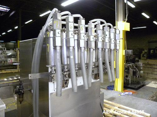 Used Filamatic Inline Piston Filler, Model CVK-300-1. Equipped with (8) 1000 cc pistons, all stainless steel. Automatic diving nozzle style, missing nozzles. Pneumatic container indexing. Self-contai...