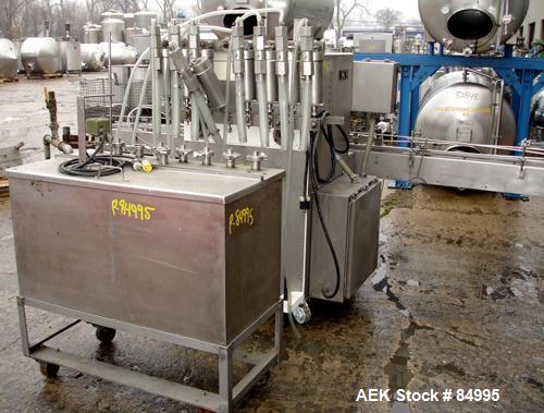 Used Filamatic Inline Piston Filler, Model CVK-300-1. Equipped with (8) 1000 cc pistons, all stainless steel. Automatic diving nozzle style, missing nozzles. Pneumatic container indexing. Self-contai...