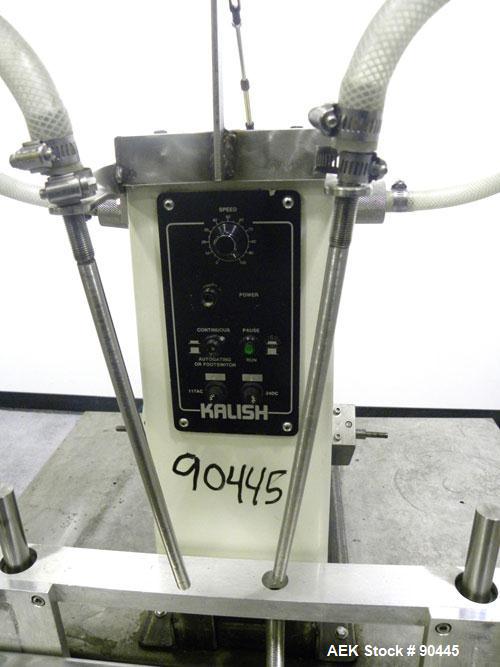 Used Kalish Semi-Automatic Twin Piston Filler, Model 2100. (2) Approximate (2) 3/8'' diameter tubes. Designed to run over a conveyor. Foot pedal controls. Driven by a 1/3 HP, 1/60/110 Volt motor. Mou...