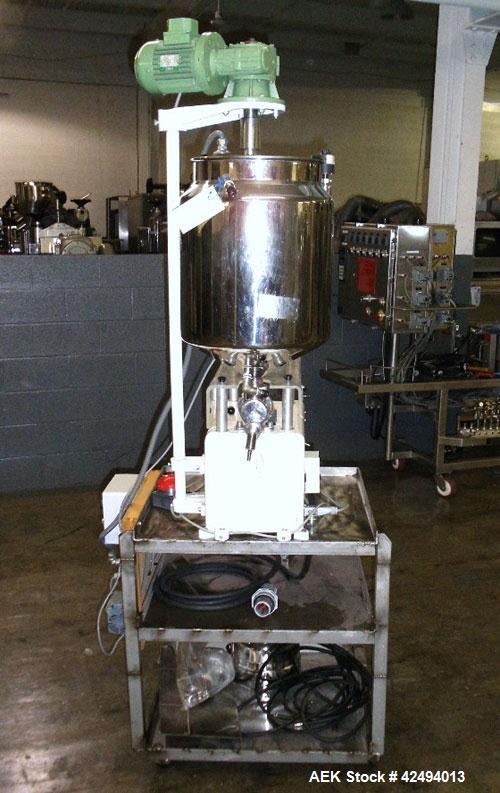 Used Kalix Single Head Piston Filler, Model 50MI, Stainless Steel. Single piston filling head, jacketed and agitated feed hopper, and foot pedal control. Mounted on a stand.