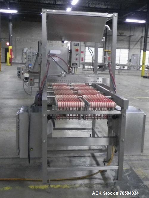 Used Quantum Model QTIA2000-12 Dual Lane Sauce Applicator. Twin piston design is rated at up to 120 pies per minute.  Machine has Allen Bradley controls.  Has continuous motion conveyors, sanitary de...