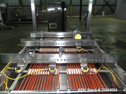 Used Quantum Model QTIA2000-12 Dual Lane Sauce Applicator. Twin piston design is rated at up to 120 pies per minute.  Machine has Allen Bradley controls.  Has continuous motion conveyors, sanitary de...