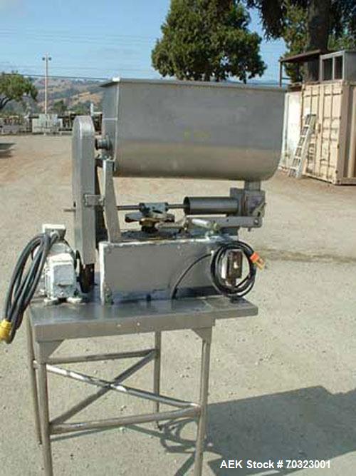 Used Used: Simplex Model AS-1 Table Model, 2-7/8" diameter x 8-1/2" long filling cylinder, 5/8" outside diameter filling spout, 12" x 27" agitated hopper, filler driven by a 110 volt motor and agitat...