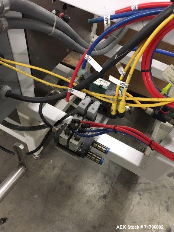 Used Simplex Model AS200 Twin Piston Filler and Accumulation Tables.