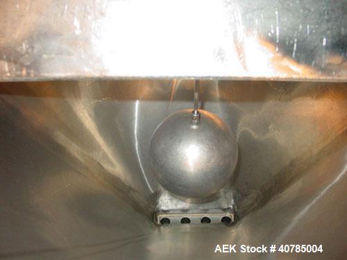 Used Simplex 4 Head Filler. Stainless steel nozzles 2" long x 3/16" opening, approximate 12 oz capacity per stroke, 28" diameter x 24" deep stainless steel hopper with cover. Mounted on a carbon stee...