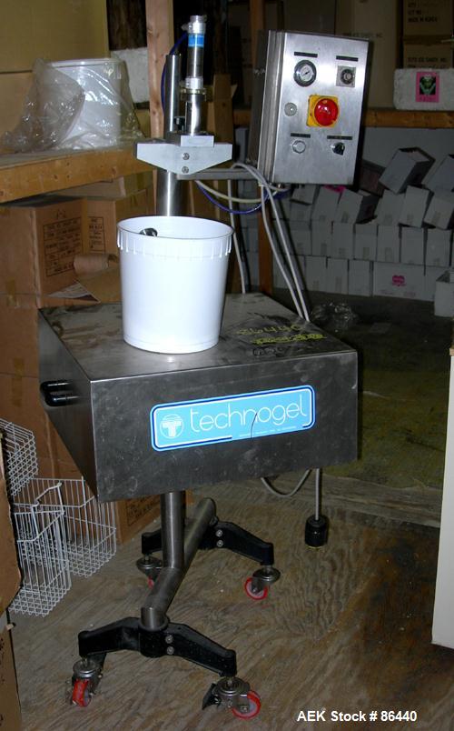 Used Technogel Ice Cream Doser Filling Machine, model Doser Desk, 304 stainless steel. Designed to fill containers of different shapes and sizes. The doser is the rotating spool type. 1.5 kw, 1/60/22...