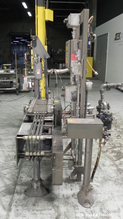 Used Thiele Model AF-2T-B1 Two Head PD Filler. Filler is designed to fill Quart to Gallon containers, (actual range 4 oz min to 185 oz maximum) at rates of 30-400 quart/min & 20-30 gallon/min. Each f...