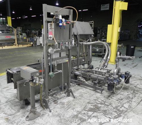 Used Thiele Model AF-2T-B1 Two Head PD Filler. Filler is designed to fill Quart to Gallon containers, (actual range 4 oz min to 185 oz maximum) at rates of 30-400 quart/min & 20-30 gallon/min. Each f...