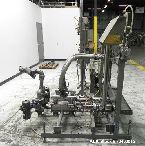 Used Thiele Model AF-2T-B1 Two Head PD Filler. Filler is designed to fill Quart to Gallon containers, (actual range 4 oz min to 185 oz maximum) at rates of 30-400 quart/min & 20-30 gallon/min. Each f...