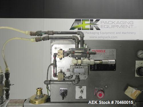 Used Thiele Model AF-2T-B1 Two Head PD Filler. Filler is designed to fill Quart to Gallon containers, (actual range 4 oz min to 185 oz maximum) at rates of 30-400 quart/min & 20-30 gallon/min. Each f...