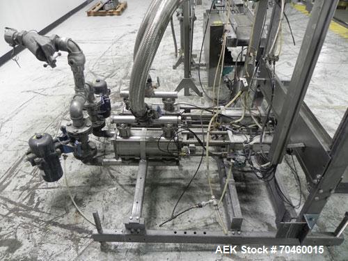 Used Thiele Model AF-2T-B1 Two Head PD Filler. Filler is designed to fill Quart to Gallon containers, (actual range 4 oz min to 185 oz maximum) at rates of 30-400 quart/min & 20-30 gallon/min. Each f...