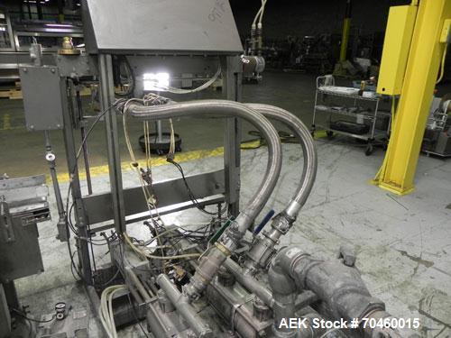 Used Thiele Model AF-2T-B1 Two Head PD Filler. Filler is designed to fill Quart to Gallon containers, (actual range 4 oz min to 185 oz maximum) at rates of 30-400 quart/min & 20-30 gallon/min. Each f...