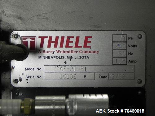 Used Thiele Model AF-2T-B1 Two Head PD Filler. Filler is designed to fill Quart to Gallon containers, (actual range 4 oz min to 185 oz maximum) at rates of 30-400 quart/min & 20-30 gallon/min. Each f...